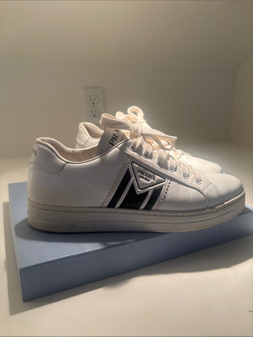Prada White Leather Low-Top Sneakers with Black Chevron Accent